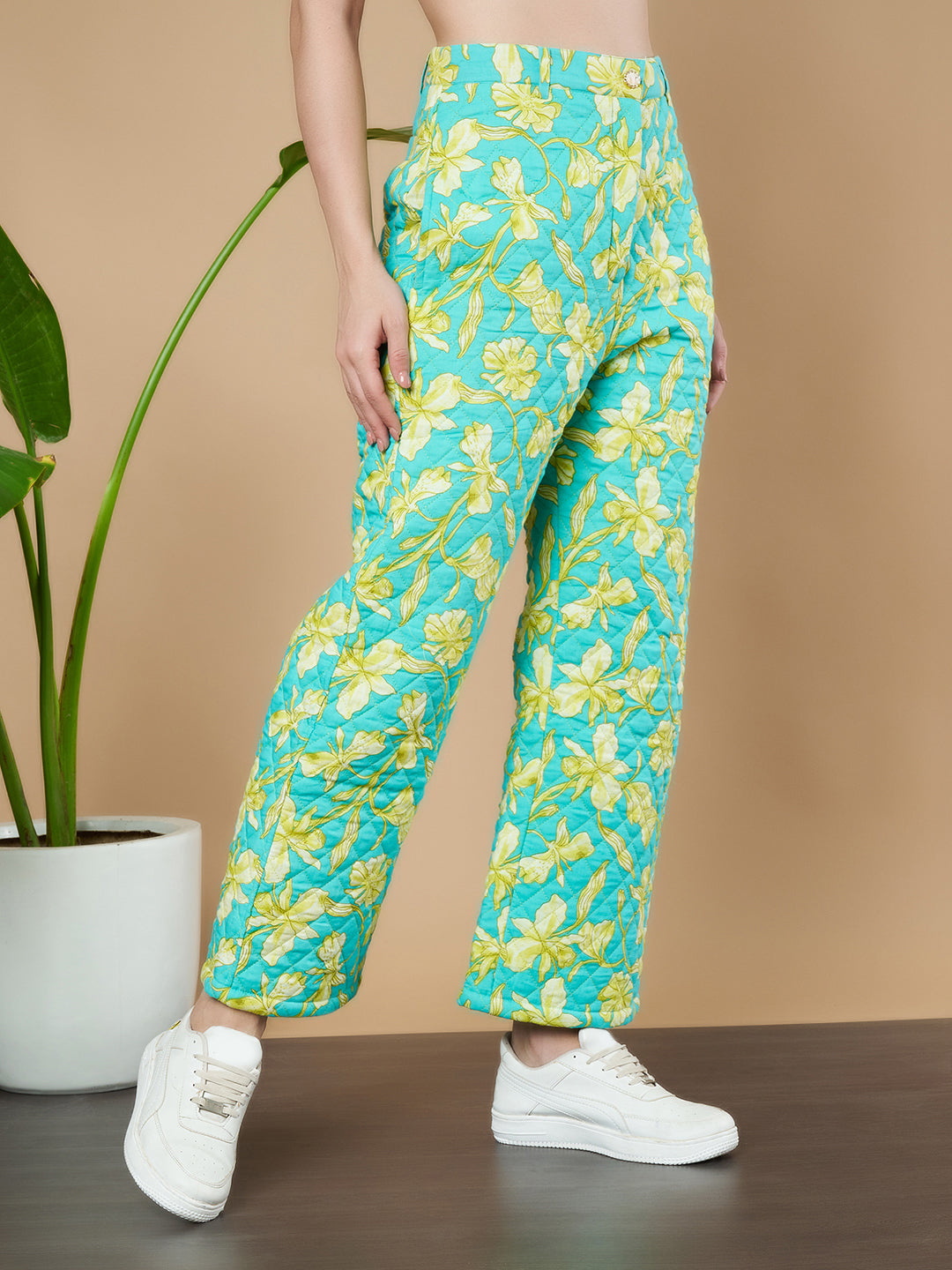 Türkise Stepphose mit Blumenmuster für Damen