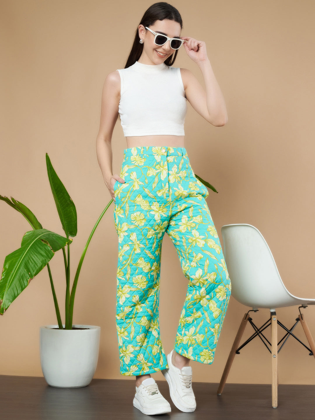 Türkise Stepphose mit Blumenmuster für Damen